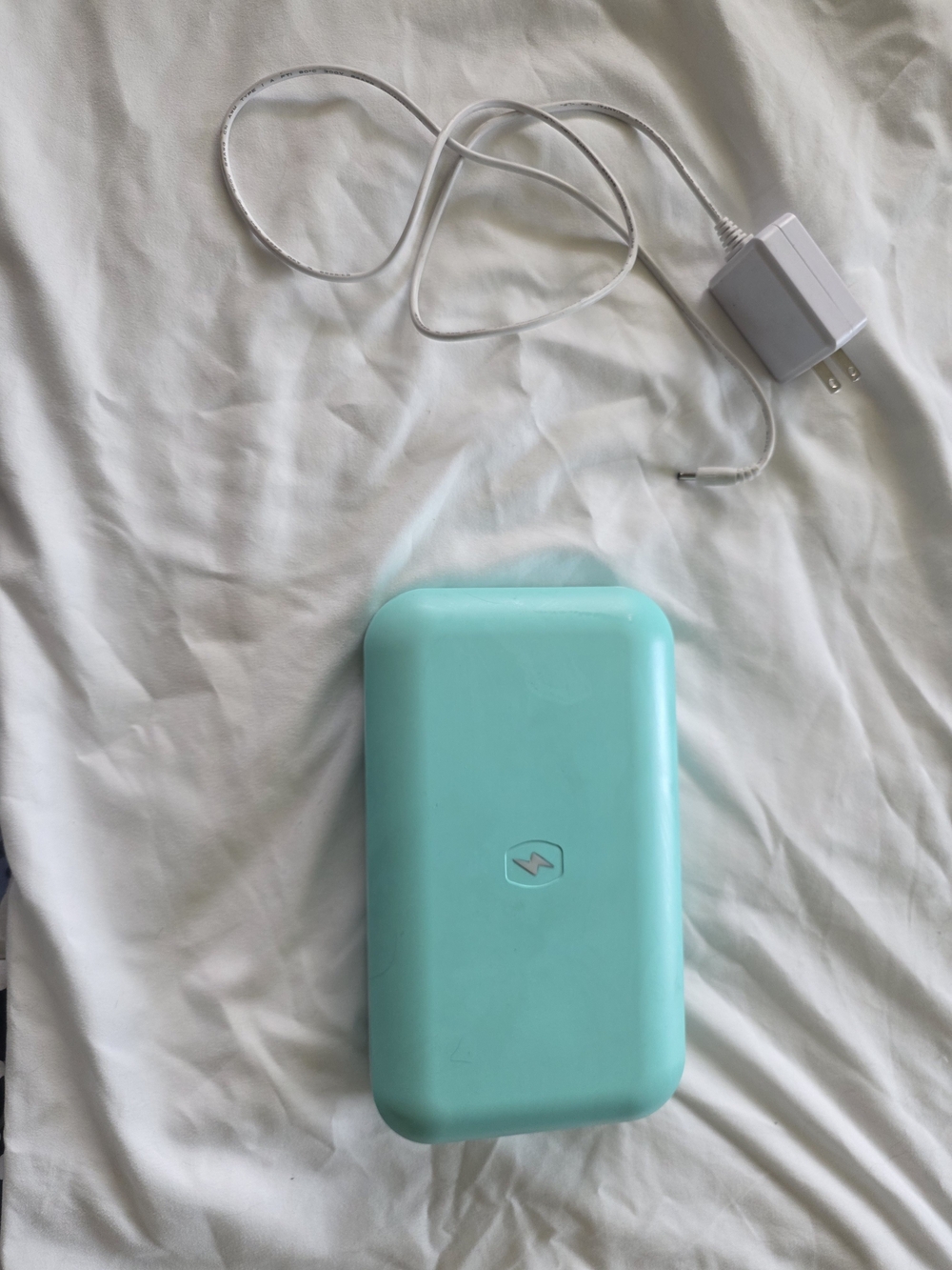 PhoneSoap 3 UV cell phone sanitizer and charger in an aqua color.